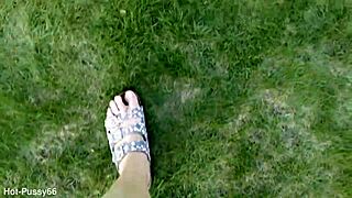 She slips off her flip-flops for a barefoot outdoor tease in the fields
