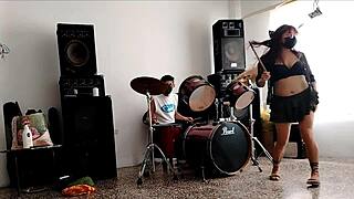 Drums pound while she strips teasing her fat ass shaking wildly!