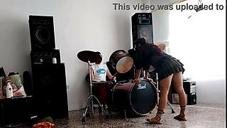 Drums pound while she strips teasing her fat ass shaking wildly!