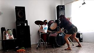 Drums pound while she strips teasing her fat ass shaking wildly!