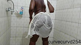 thick ebony booty shakes teasingly under shower streams