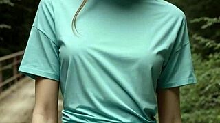 standing barefoot in lingerie on forest bridge teasing viewers