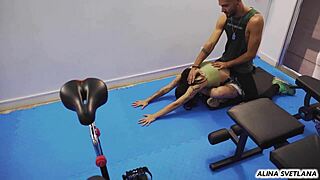 Gym slut bends for trainer's cock amid training crowd