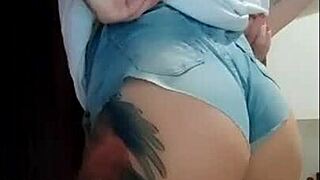 Red safada bends over in tight jeans flashing big ass tattooed tits