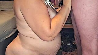 pregnant milf slurps massive cock hungrily