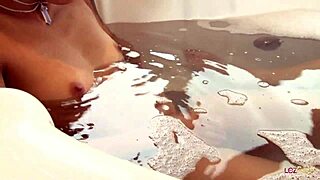 Pierced asian lesbian's jacuzzi pussy tease