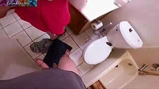 Mature babe catches guy jerking off in bathroom and strokes him dry