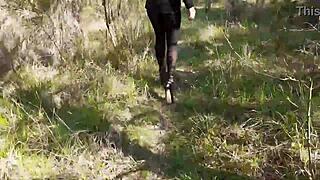 Woman struts high heels through enchanting forest paths
