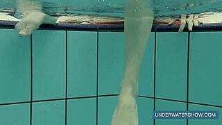 Katya Okuneva teases in red dress by the pool