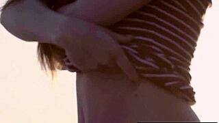 Clara strips naked and poses big natural tits on boat