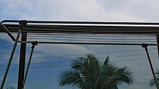 naughty exhibitionist FLASHES big skirt ass wildly on open balcony