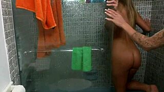Busty babes dive pussies in steamy lesbian shower lick