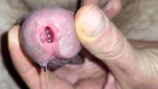 Watch shimmering precum erupt into thick cum ropes