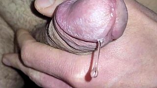 Watch shimmering precum erupt into thick cum ropes