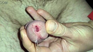 Watch shimmering precum erupt into thick cum ropes