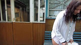 i love watching this plump milf smoke and piss wet pussy on street bench outdoors