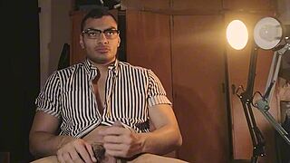 sexy muscular bodybuilder strokes monster big cock in glasses and stripes masturbation frenzy