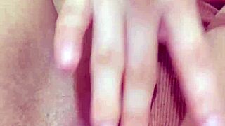 Curvy student teases wet pussy in tight shorts during solo masturbation session