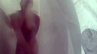 sexy blonde dahlia strips teases and fingers her wet pussy in steamy shower