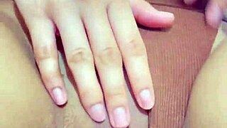 Curvy student teases wet pussy in tight shorts during solo masturbation session