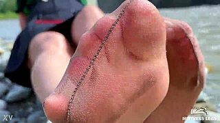 hey wanna stare at my cute tan nylon soles and toes right by the riverside?