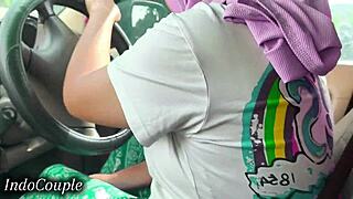 indonesian hijab babe drives while slurping boyfriend's throbbing cock in viral clip
