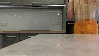 i'm the long-legged blonde in heels and miniskirt flashing ass in kitchen