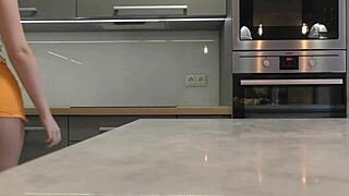 i'm the long-legged blonde in heels and miniskirt flashing ass in kitchen