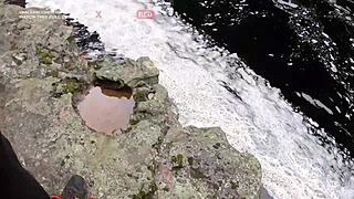 couple rides passionately in bahia waterfall outdoors