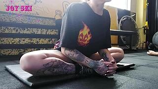 Watch This Tattooed Alternative Hottie Stretch Seductively In Gym