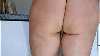 Spy cam catches mature in see-through kitchen panties tease