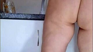 Spy cam catches mature in see-through kitchen panties tease