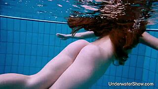 bold sexy babe flaunts magnificent nude body underwater pool tease