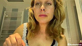 Mature brunette milf next door strips teases huge fake tits