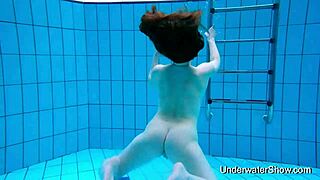 bold sexy babe flaunts magnificent nude body underwater pool tease