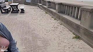 busty milf flashes huge natural tits topless on public bench