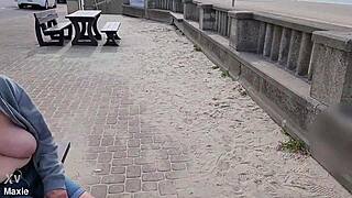 busty milf flashes huge natural tits topless on public bench