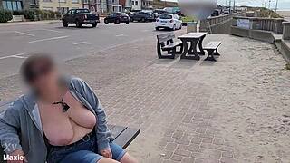 busty milf flashes huge natural tits topless on public bench