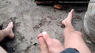 A carefree visitor plays joyfully on the sunlit public beach amid outdoor waves and sand.