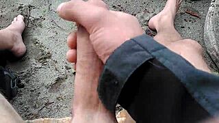 A carefree visitor plays joyfully on the sunlit public beach amid outdoor waves and sand.