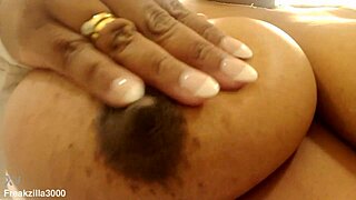 Ebony wife rubs her huge sensitive nipples craving intense tit stimulation and pleasure