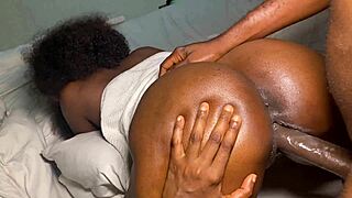 curvy ebony babe with big boobs chats intimately with black guy in bedroom