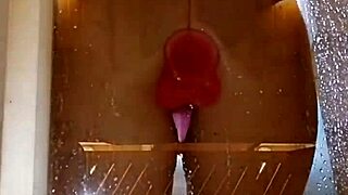 girl plays with toy in shower showing juicy ass