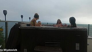 Babes splash and laugh wildly in steamy hot tub fun!