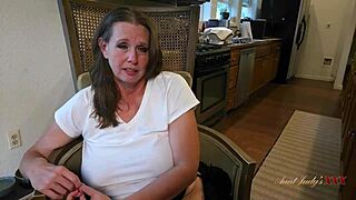 mature babe spreads wide on desk her big tits heaving with lustful desire