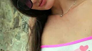 bikini babe flashes her curves seductively on sunny beach outing