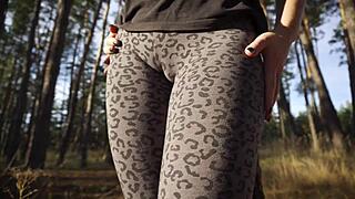 girl flaunts huge cameltoe through tight leopard leggings outside