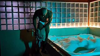 Tanned stud strokes huge cock in bubbly bath tub