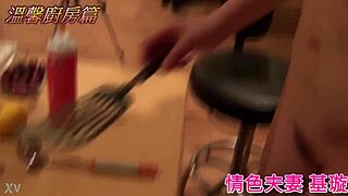 Intimate couple shares tender kitchen moments together