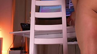 Blonde dances wildly with dildo wedged between legs!